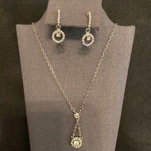Silver tone necklace and earring set with crystals.